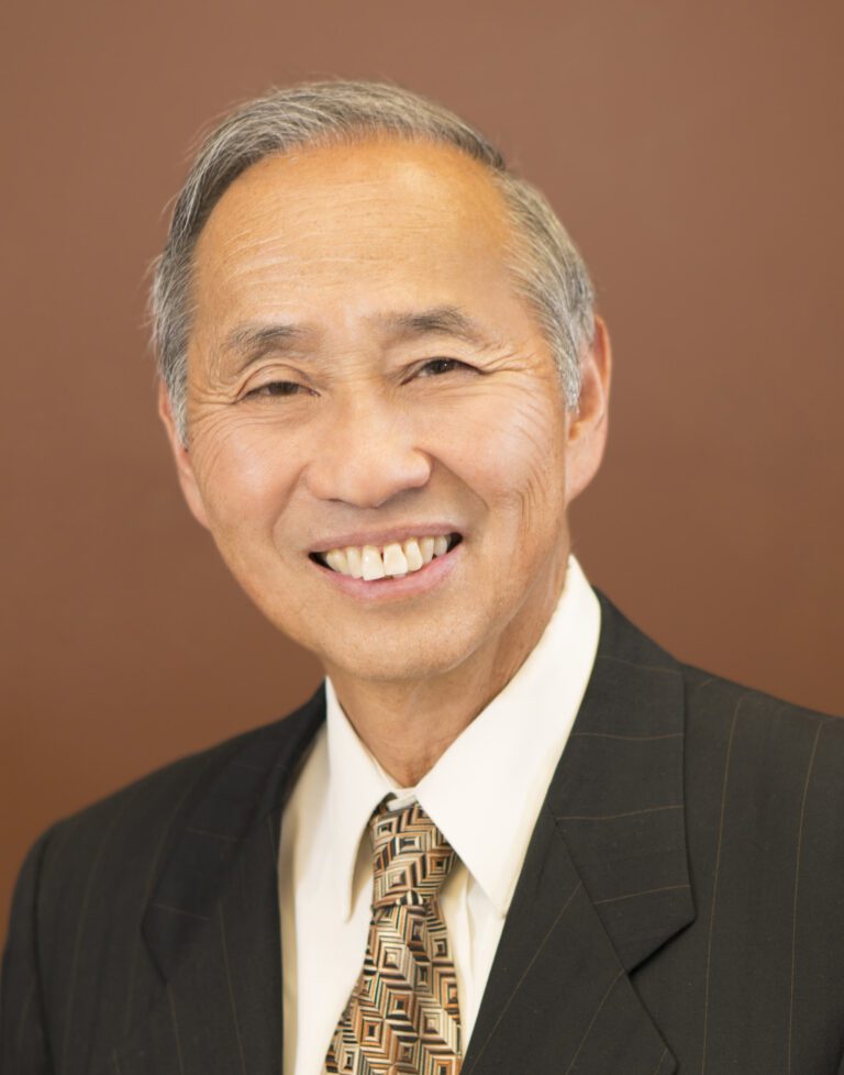 Jerry Gin Portrait Image With Black and White Hair
